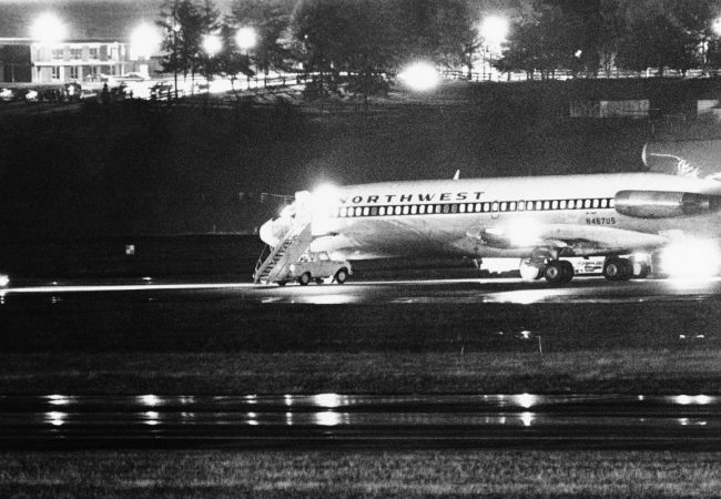 The Mystery of DB Cooper. The hijacked Northwest Airlines jetliner 727 sits on a runway for refueling at Tacoma International Airport, Seattle, Washington (Nov. 25, 1971). Photo Credit: Courtesy of HBO