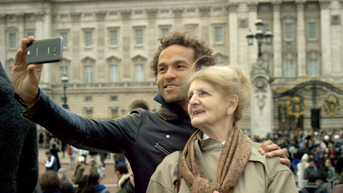 Sian-Pierre Regis and his mother Rebecca Danigelis at Buckingham Palace. As seen in Duty Free, directed by Sian-Pierre Regis. Photo credit: Joey Dwyer. Image courtesy of Duty Free Film