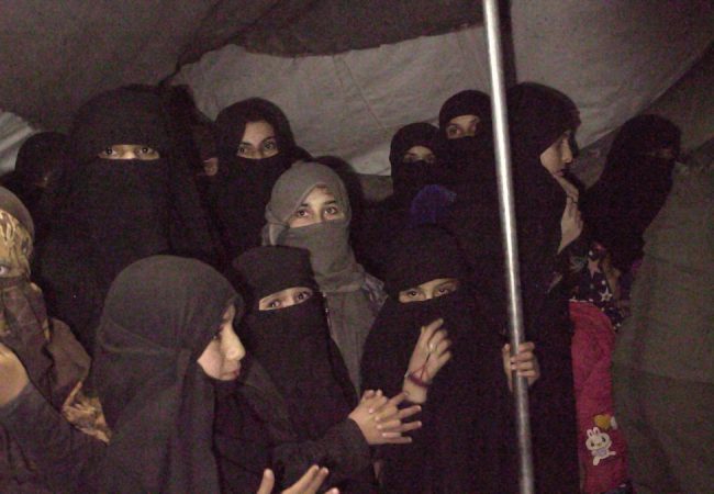 A group of women and girls are rounded up in order to find one of the Sabaya (sex slaves) held by ISIS in Syria’s Al - Hol camp, the most dangerous camp in the Middle East. As seen in Sabaya, directed by Hogir Hirori. Image courtesy of MTV Documentary Films.